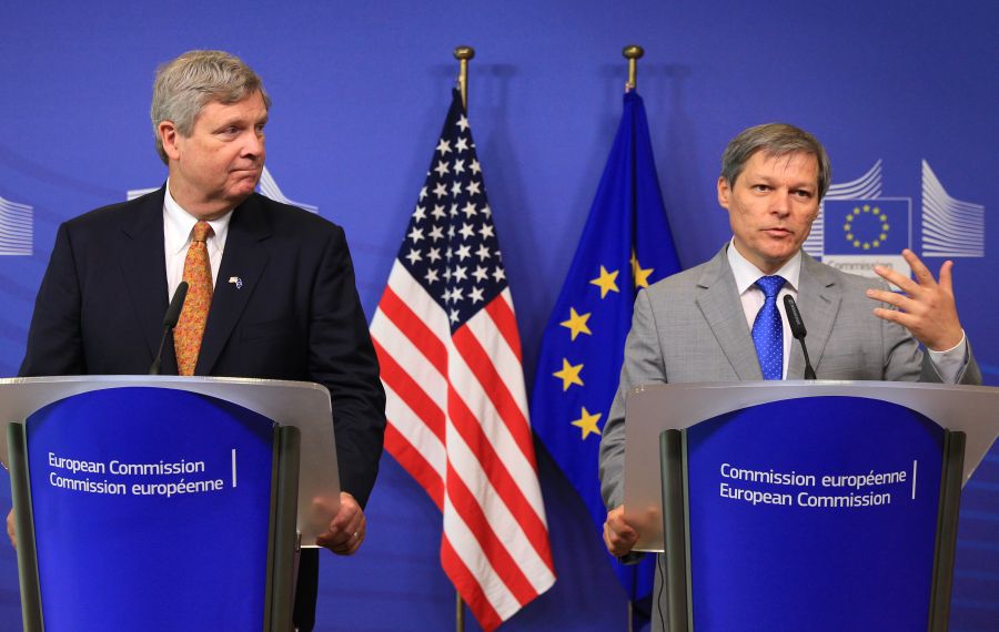European Commissioner for Agriculture Dacian Ciolos, right, and U.S. Secretary of Agriculture Tom Vilsack, address the media at the European Commission headquarters in Brussels, Tuesday, June 17, 2014. (AP Photo/Yves Logghe)